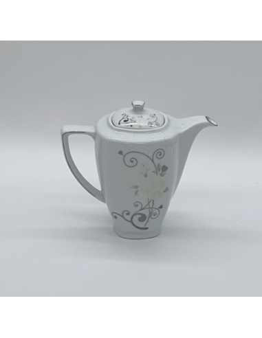 Witte porseleinen theepot