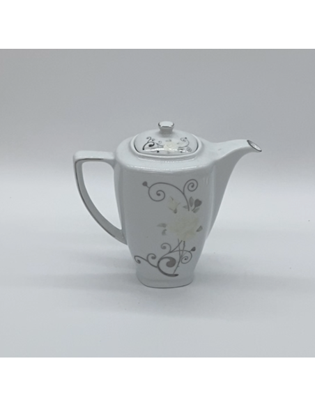 Witte porseleinen theepot