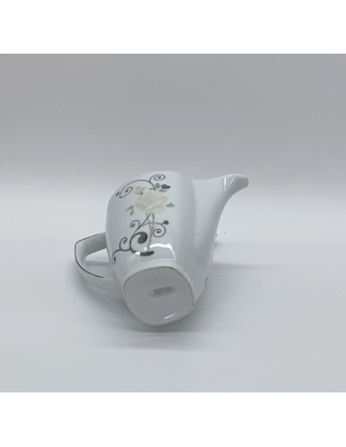 Witte porseleinen theepot