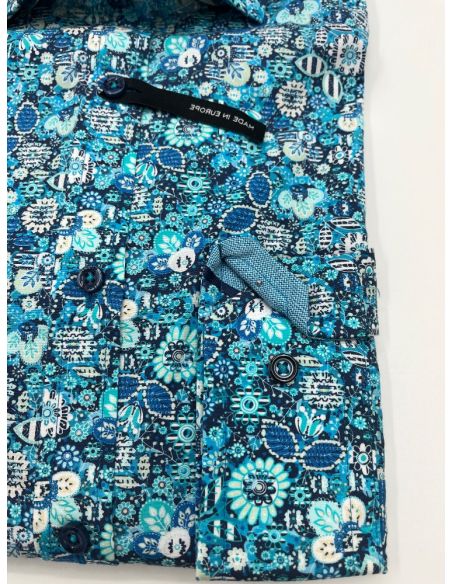 Chemise à motifs fleuris bleus. Taille 38