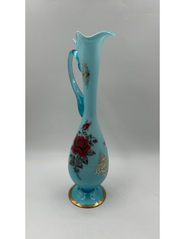 Vase en verre bleu avec motif floral